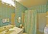 Private en suite bath for the first floor king bedroom tub/shower combo