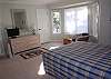 This bedroom has a queen bed, sitting room off this bedroom, flat screen TV and full bath