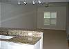 Kitchen opens to the spacious living room area
