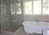 Enjoy a large tile shower and deep tub in the master bath