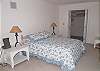 Double bed, large room, walk in closet, TV shares bath with twin bedroom, third level