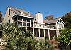Rear exterior, open decks and screened porch off the master suite.  Covered lower deck with outdoor shower