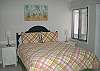 Features a queen bed and bath TV here too.