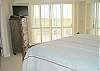 Master bedroom w/ TV and oceanview.
