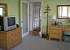 great kids room with trundle bed and TV bath just outside the hallway