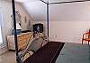 Upstairs queen bedroom with TV and full bath with shower