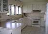 Kitchen offers plenty of counter space and storage areas