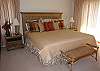 Lovely master bedroom with deck and bath with double pedestal sinks and jacuzzi tub