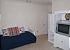 Trundle bed, TV, walk in closet, shares bath with queen bedroom, first floor