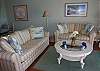The living room is beautifully appointed with upscale furnishings.  The sleeper sofa and love seat create a comfortable living space. There is a large flat TV panel with DVD player and stereo.