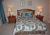 Bedroom with queen bed and full bath