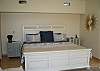 The master bedroom suite encompasses the upstairs level and has ocean views, a sitting area, deck and upscale bath
