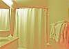 Private bath for the queen bedroom with tub/shower