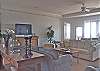 Large and spacious living area with lots of seating and large flat screen TV
