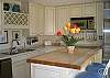 Impeccable kitchen renovation features high end appliances and butcher block island