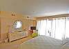 View of the bedroom towards the sliding glass door