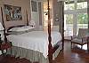 Queen bed with pine flooring, deck access and private bath