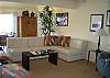 Tastefully decorated living room with tile flooring