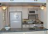Beautifully renovated kitchen with raised granite countertops