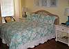 Bedroom features king bed and private bath