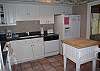 Kitchen features tile flooring and new granite countertops
