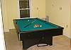 First level game room offers pool table, air hockey and a half bath