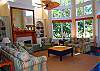 Soaring ceilings and floor to ceiling windows offer magificant views of the lowcountry landscape
