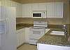 Granite counter tops, ceramic tile flooring and open kitchen