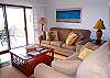 View of living area towards the deck with ocean views