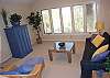 Upstairs den area has sleeper sofa and TV