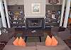 Sitting area framed by the fireplace and built in bookcases