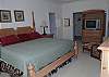 King bed, TV, walk in closet and private bath