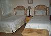 Second bedroom features twin beds and full bath