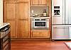 Wine cooler, stainless appliances and hardwood flooring