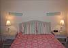 Queen bedroom located on the first level, shares bath with twin bedroom has TV