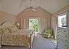 Another view of the master bedroom with king bed