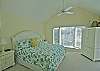 Another view of the master bedroom located on the upper level