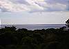 Enjoy long range open ocean views across the street from your covered deck