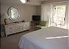 Enjoy this bedroom with king bed, new flat screen TV and bath access