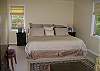 This bedroom features a king bed and sitting area