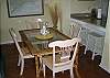 Dining area and granite bar with stools for a quick snack or morning cup of coffee