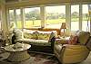 Bright and spacious living area has a vaulted ceiling and fabulous views of the lagoon