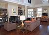 Expansive great room with wide pine flooring, soaring ceilings and magnificent views