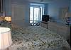 Master bedroom features a king bed, private bath and TV