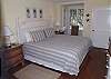 The bedroom features a king bed and renovated bath. There is a flat panel TV too!