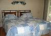 Two twin beds and hardwood flooring