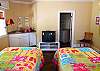 Another view of twin bedroom.  Wet bar with small refrigerator