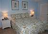 Beautifully furnished master bedroom with king bed, TV and private bath
