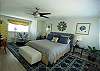 Located on the home's upper level this large suite features a wall mounted flat screen TV and full private bath