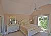 Located on the upper level this lovely suite has a king bed, access to the deck and private bath with large tub/shower and double vanity
